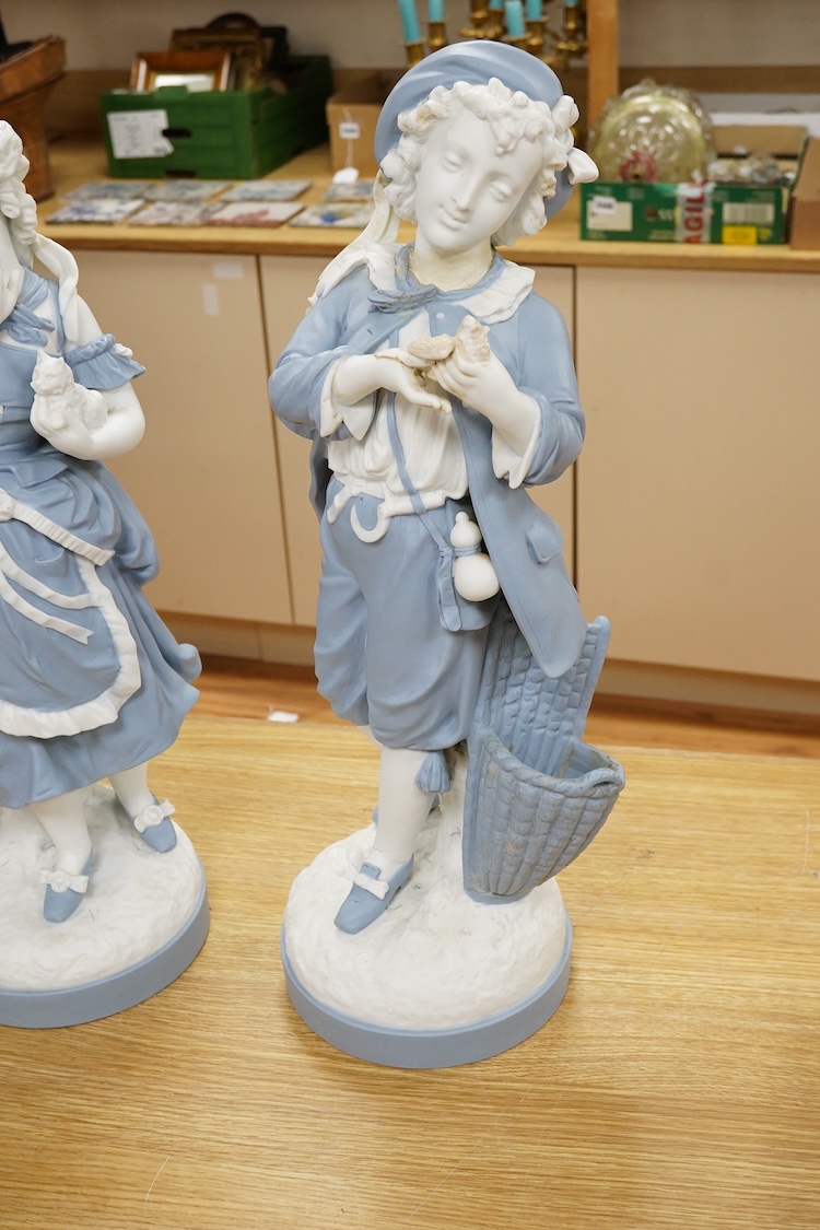 A pair of French part-bisque figures, 57cm high